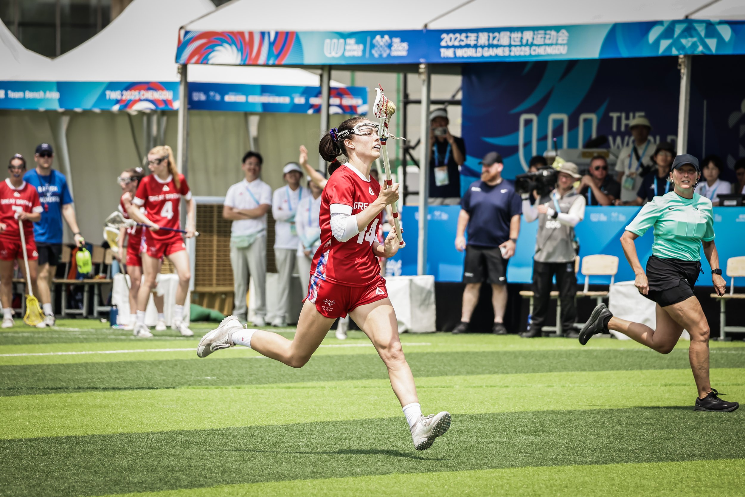 Minty Loxton racing towards goal with ball in stick