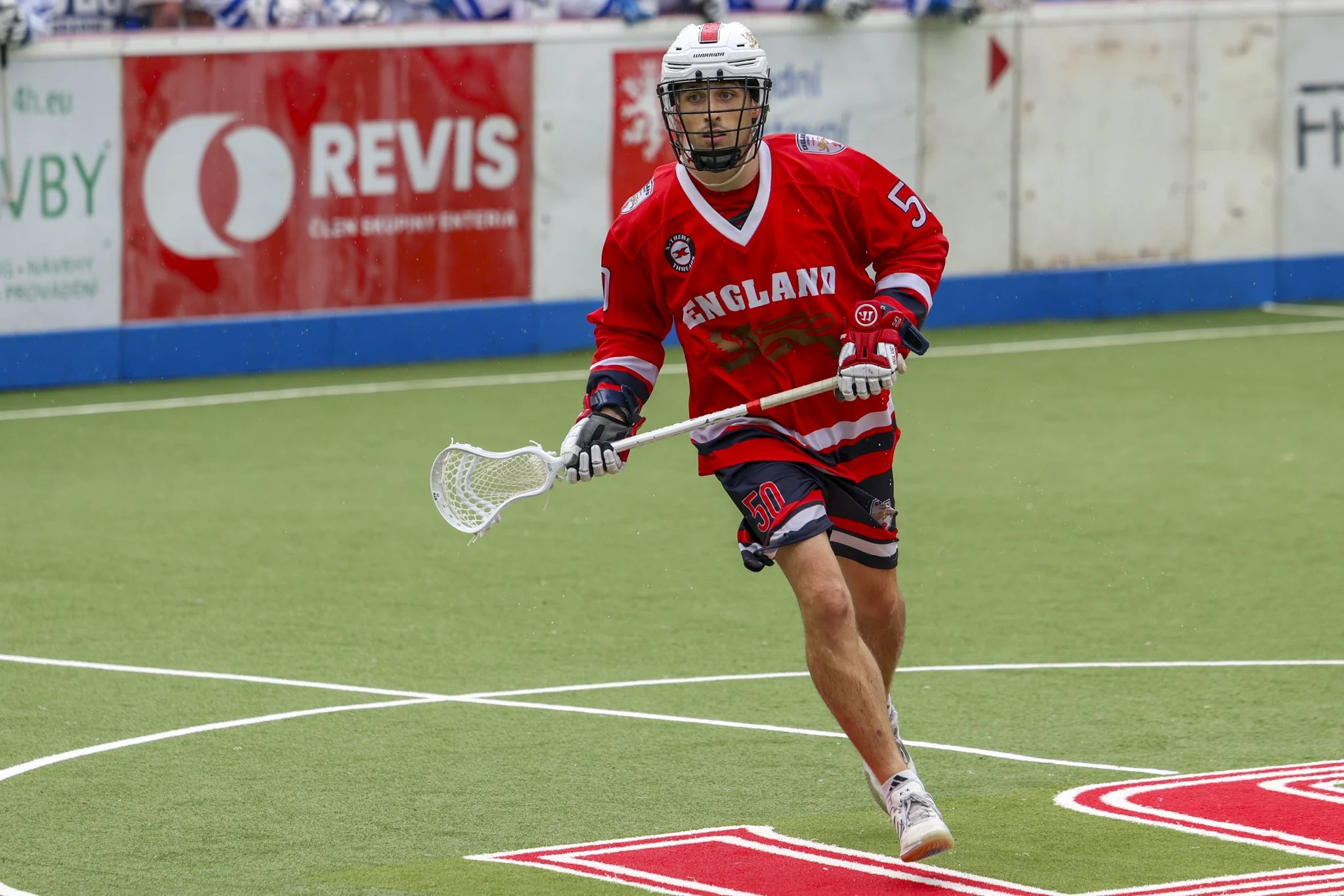 Tom Roper runs with stick in hands