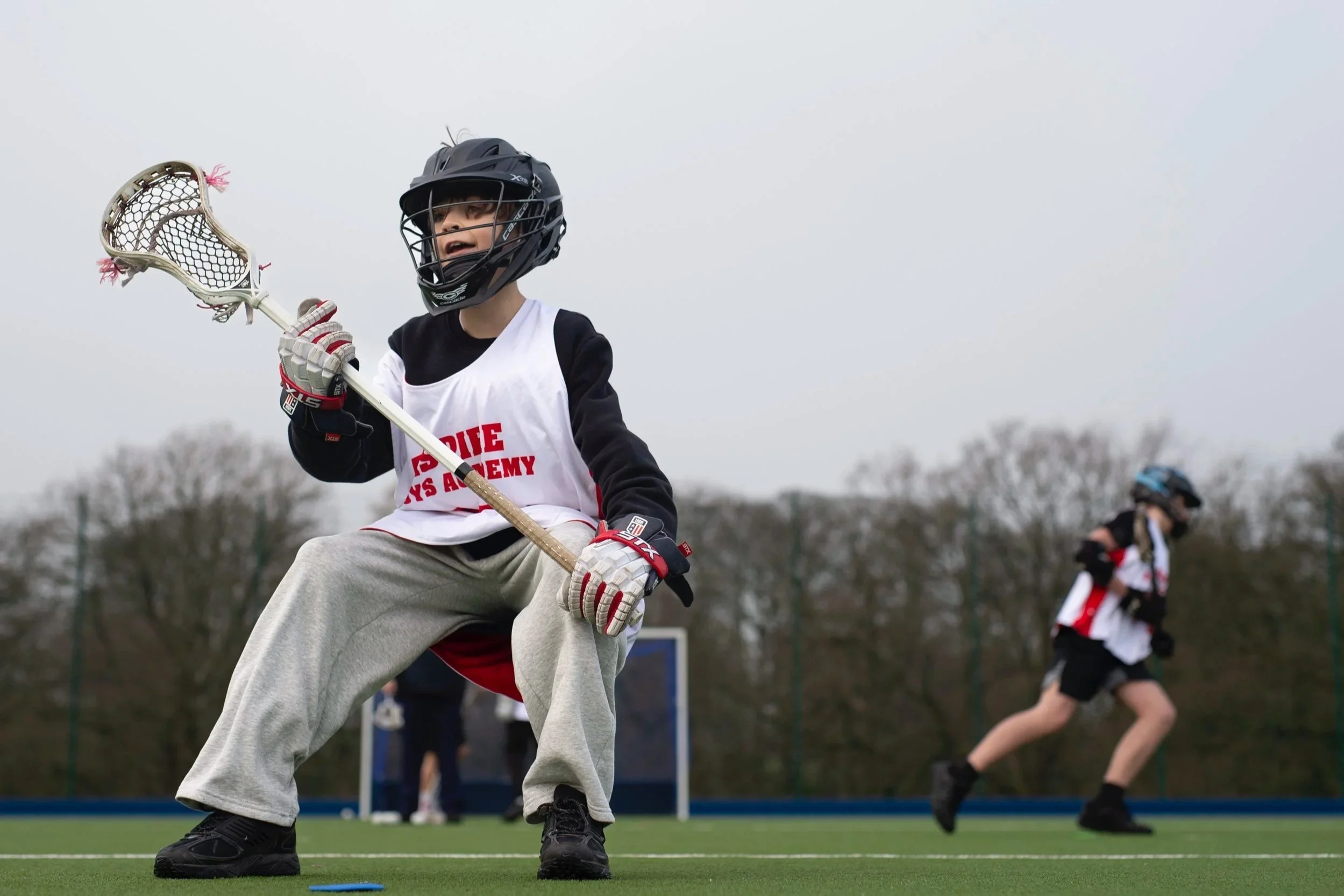 Player on Boys Aspire Programme with stick in hand