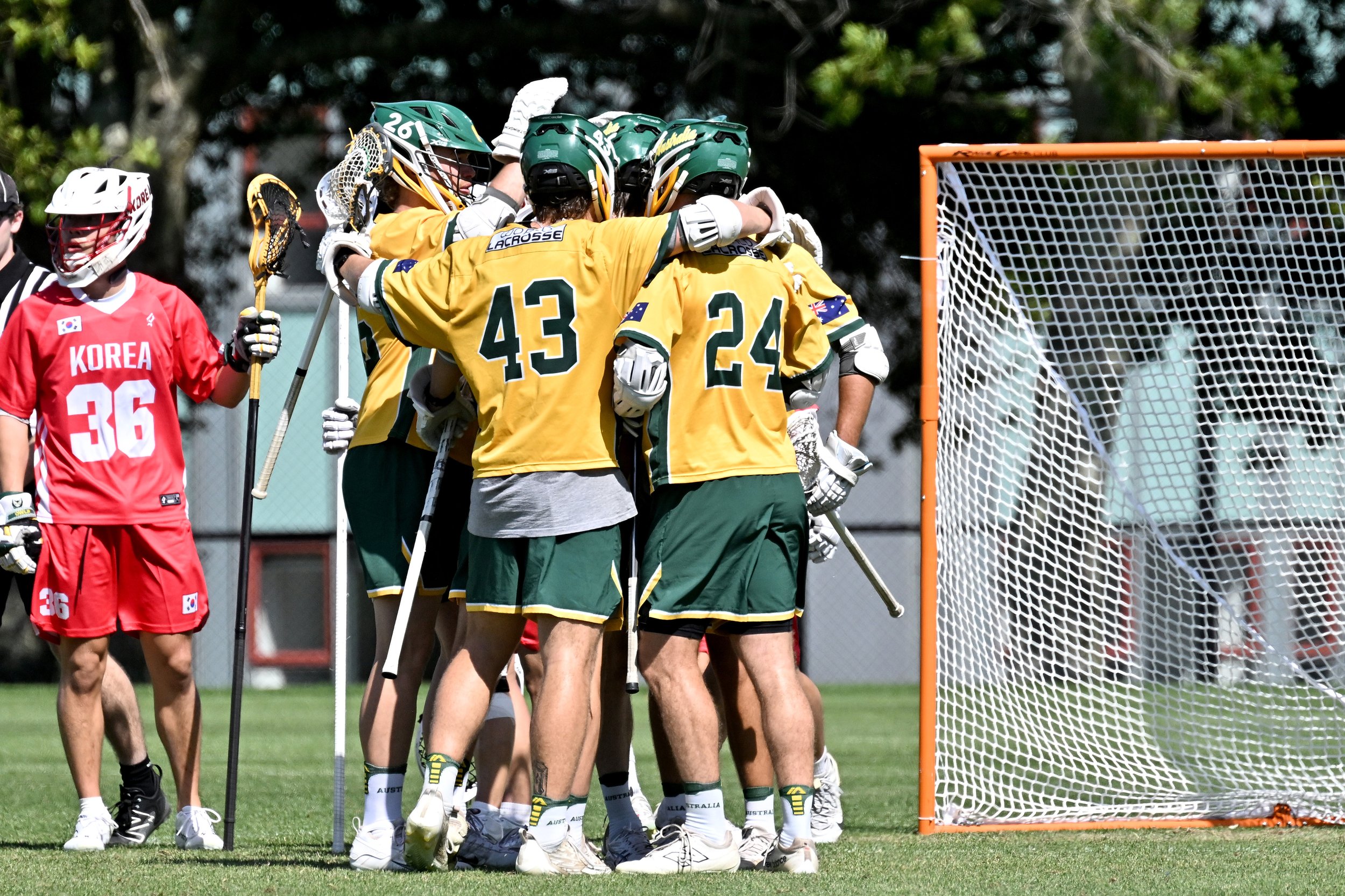 Australia players huddle after scoring against Korea