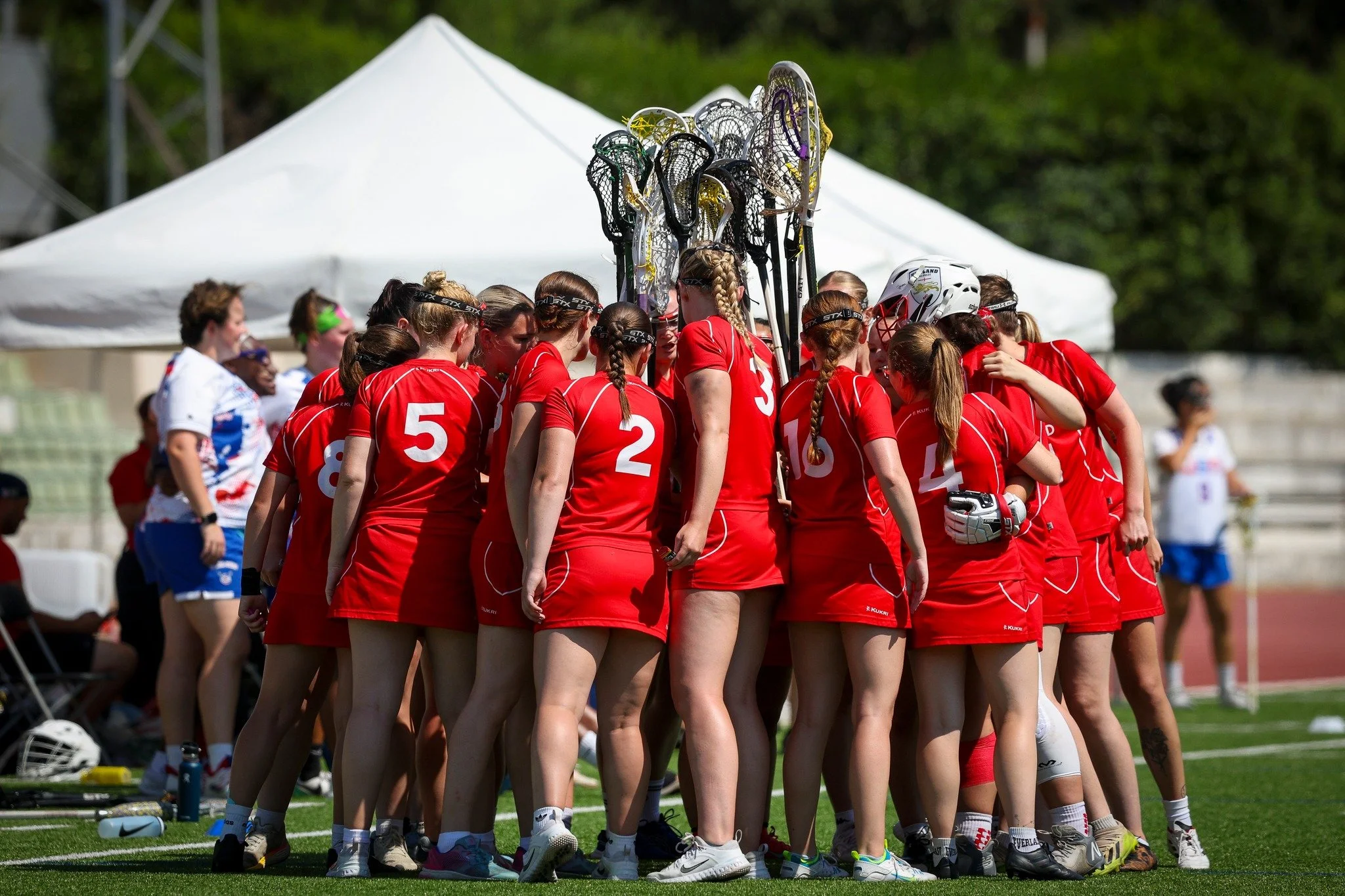England Lacrosse University Aspire Programme players in huddle