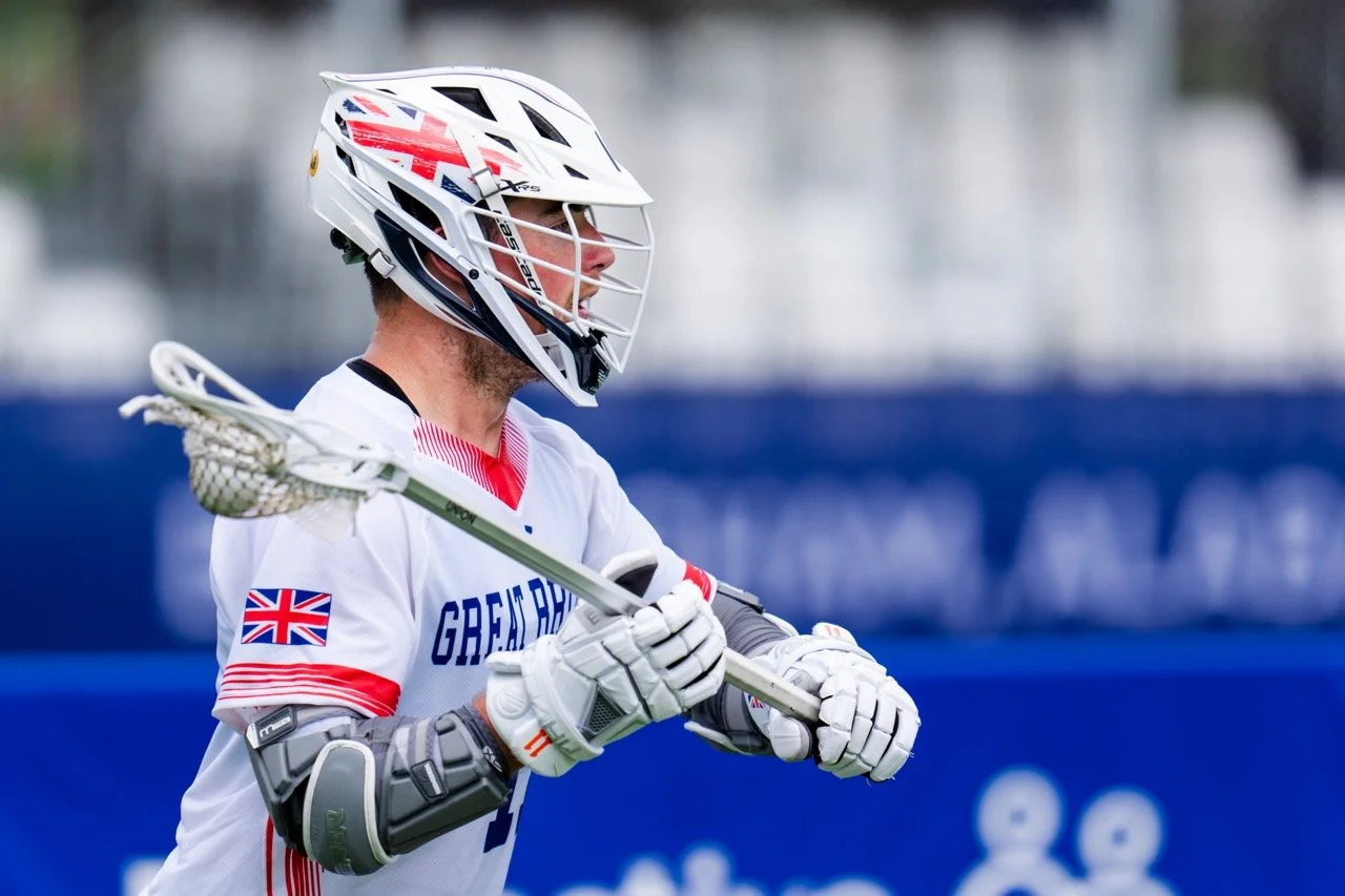Ryan Hunns with ball in stick in GB kit