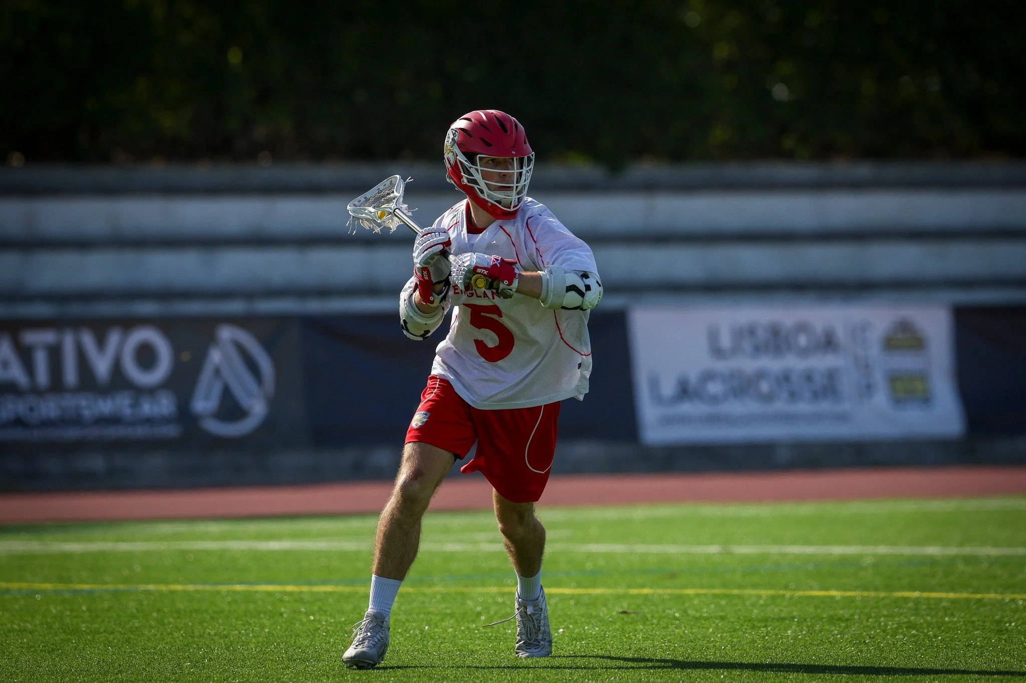 England Lacrosse University Aspire Programme player with ball in stick