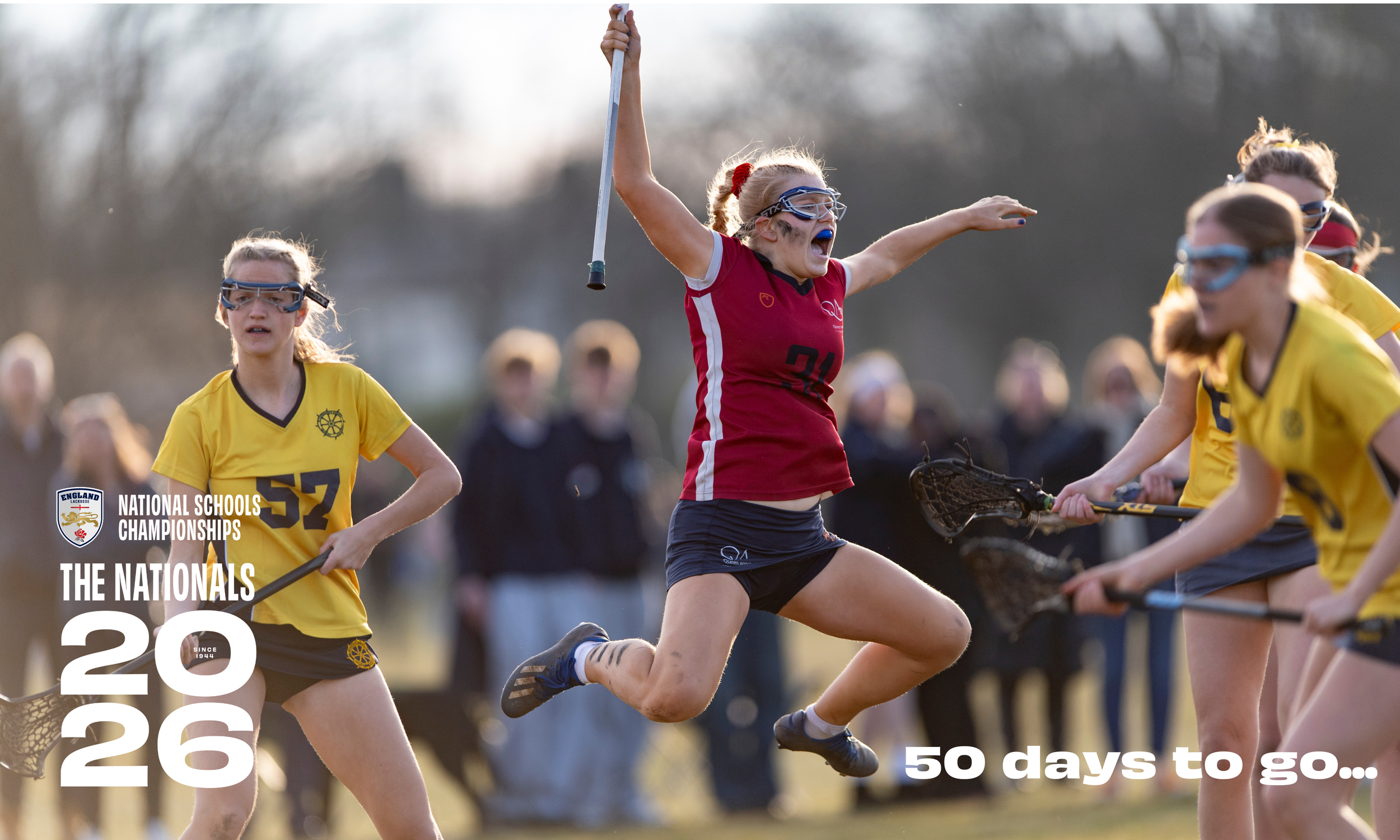 Queen Anne's player jumps in the air to celebrate winning National Schools