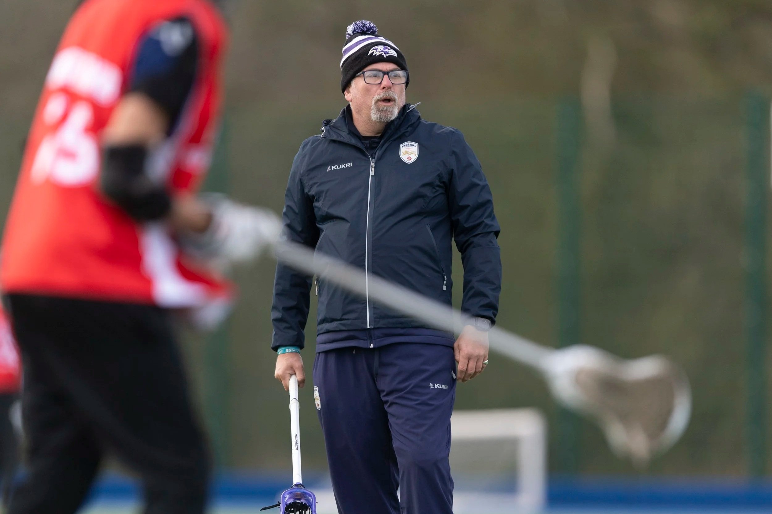 Ben Howells coaching at the England Lacrosse Aspire Programme with stick in hand