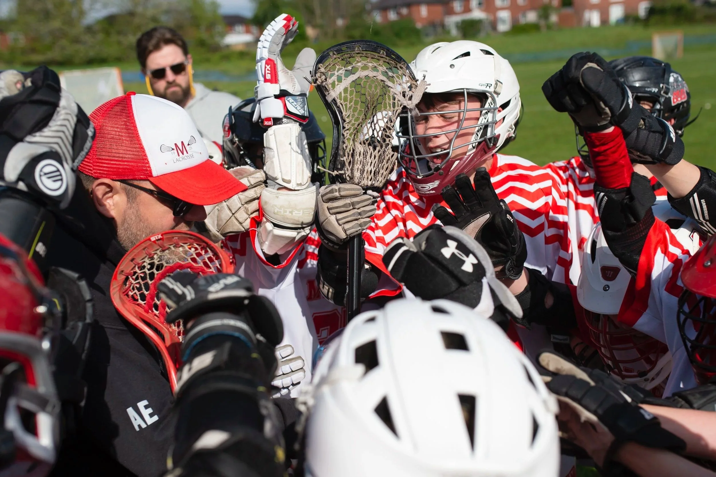 Young players celebrate in a huddle