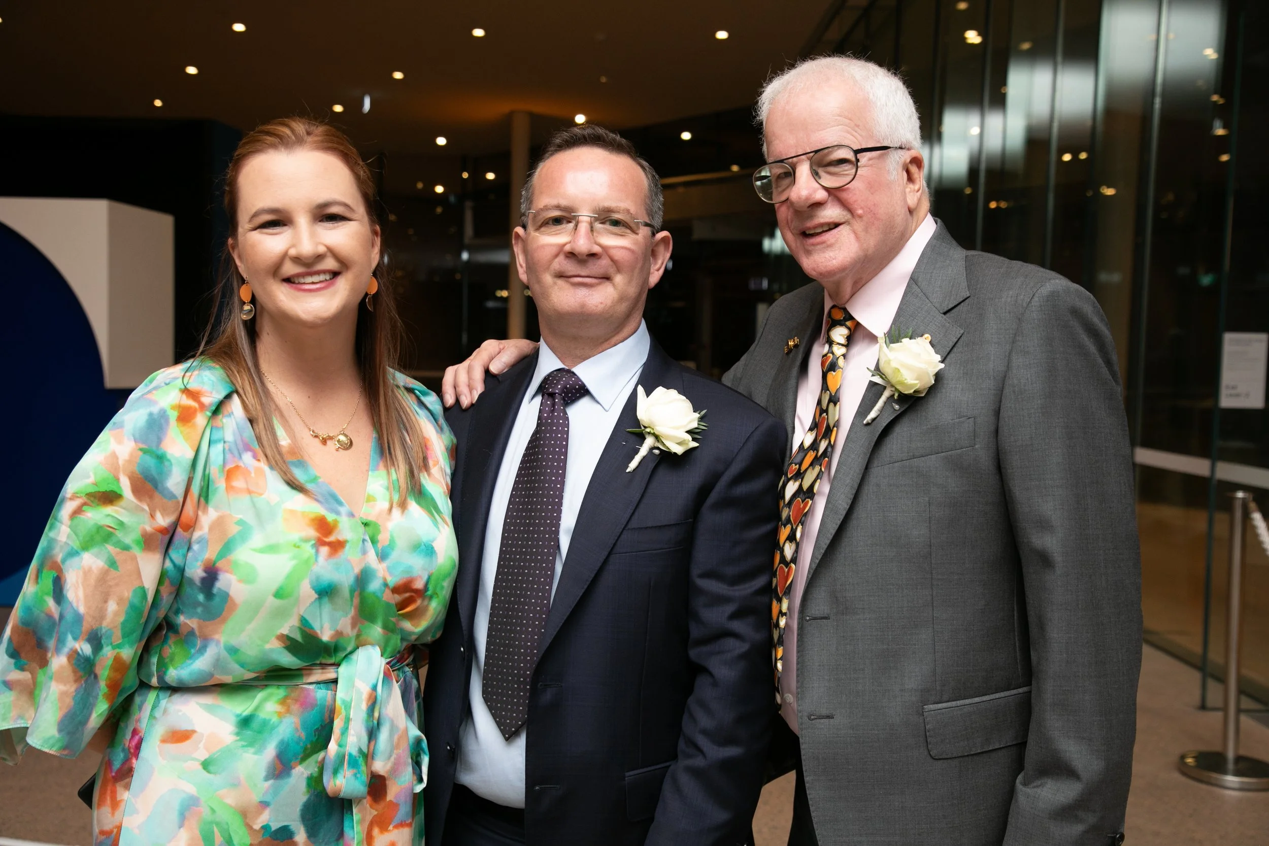 Married By Leah standing with two grooms after their ceremony - married at the Modern Art Gallery of NSW