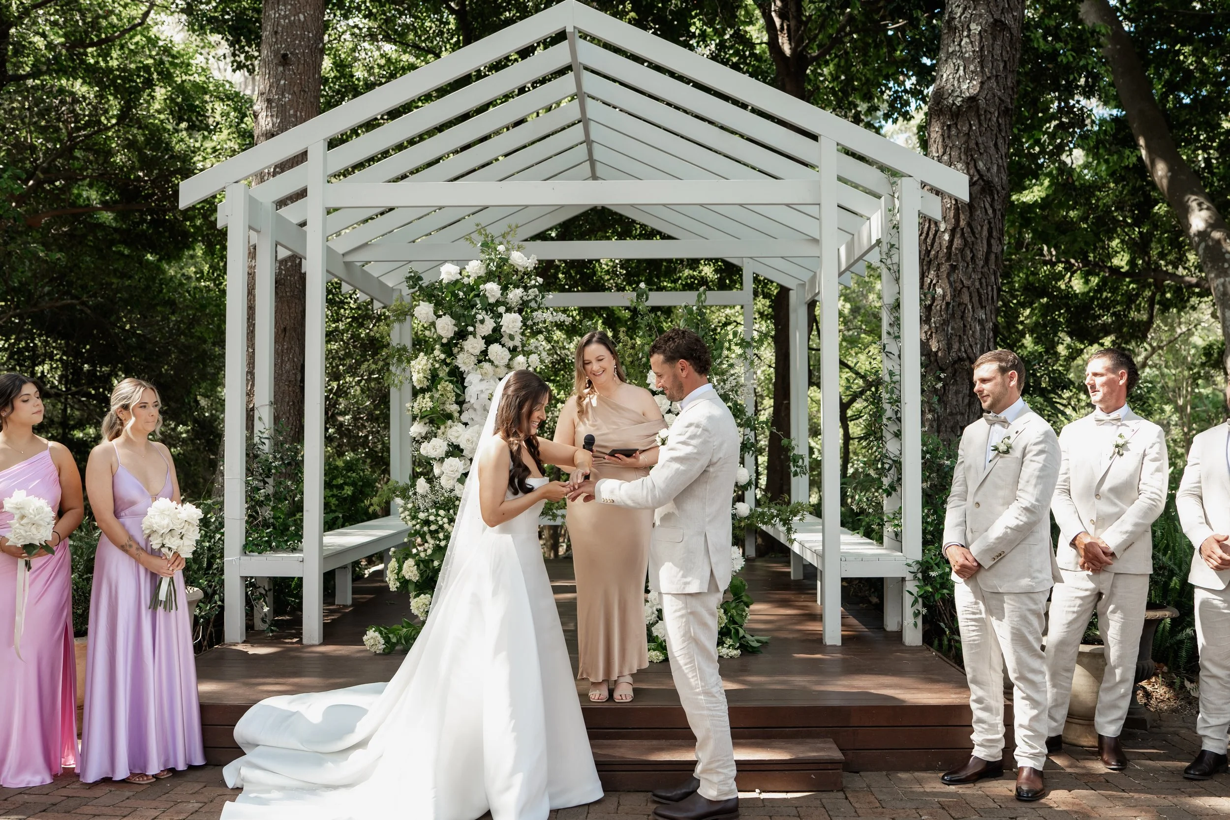 Married by leah with bride and groom exchanging rings at The Lodge Jamberoo
