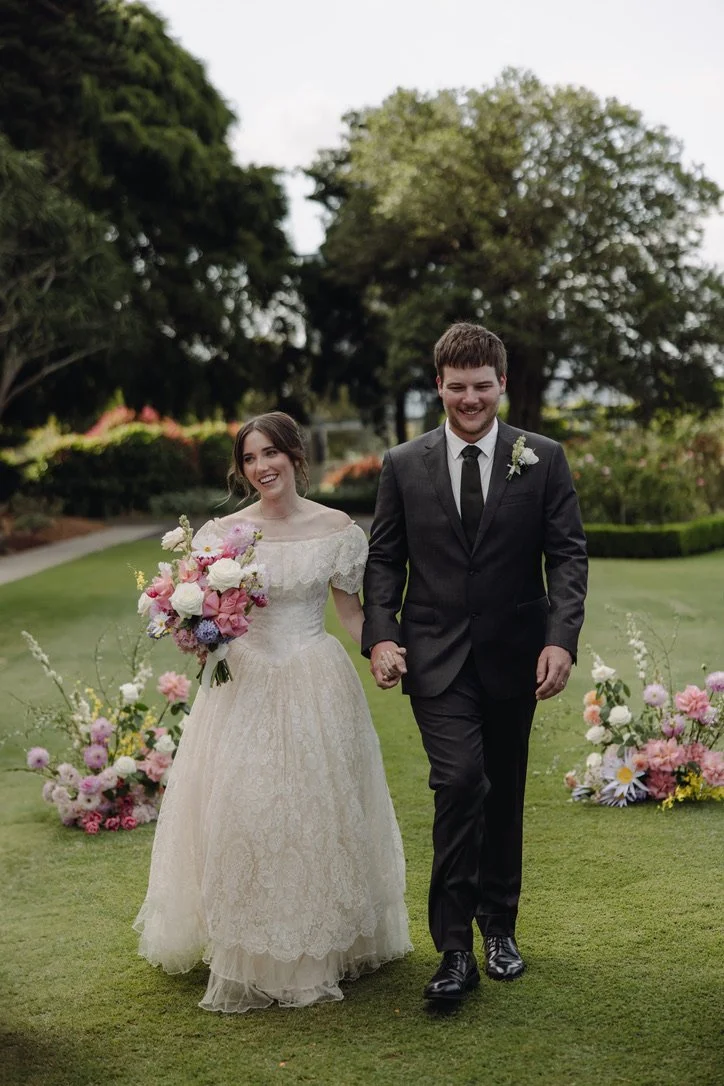 Bride and Groom in the Rose Garden at Botanic Gardens of Sydney, after being married by Married By Leah