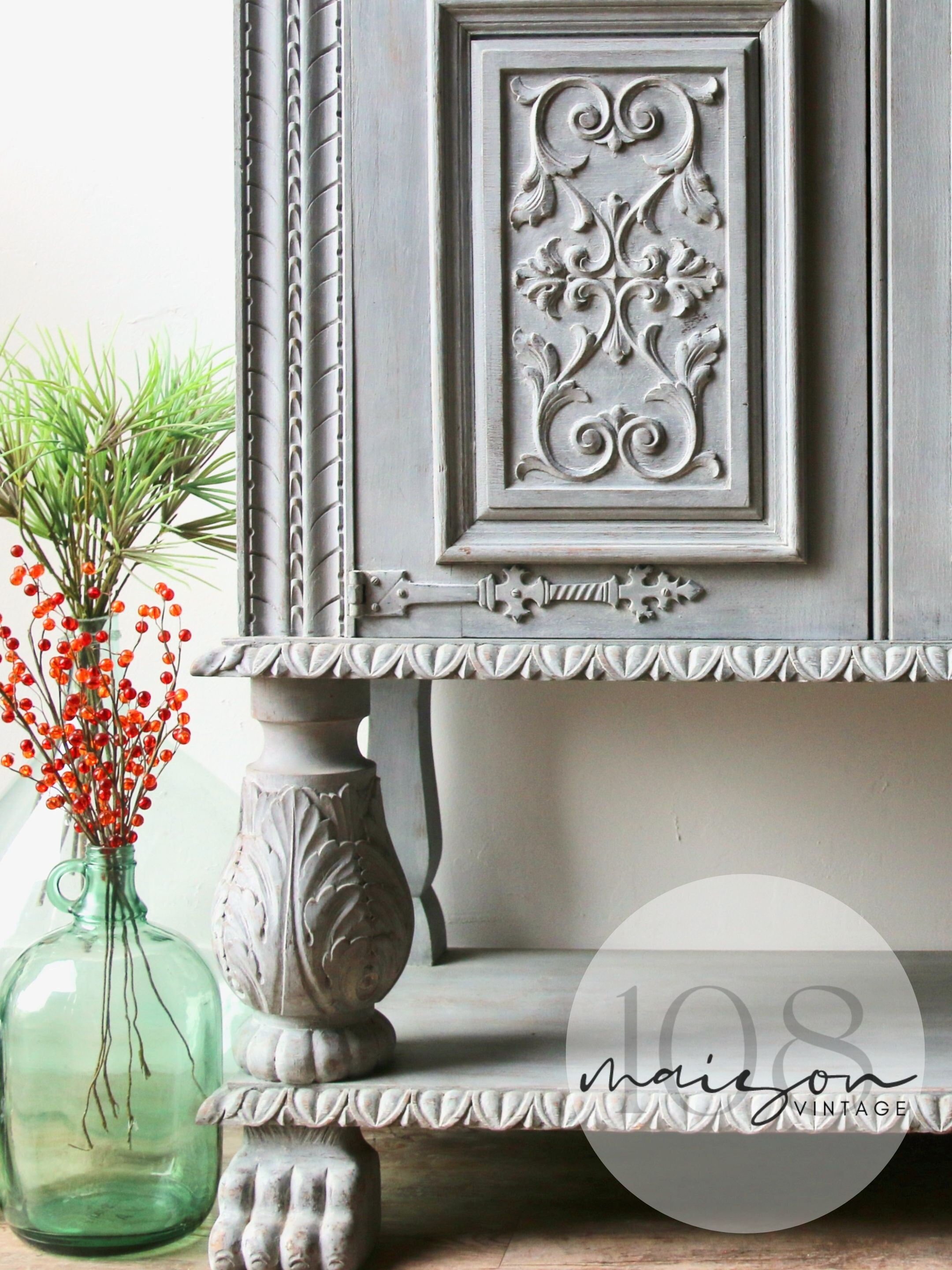 Solid wood 2 door hutch/cabinet with intricate carvings hand-painted in light gray with ivory interior. Vintage French Bibliothèque 1960s