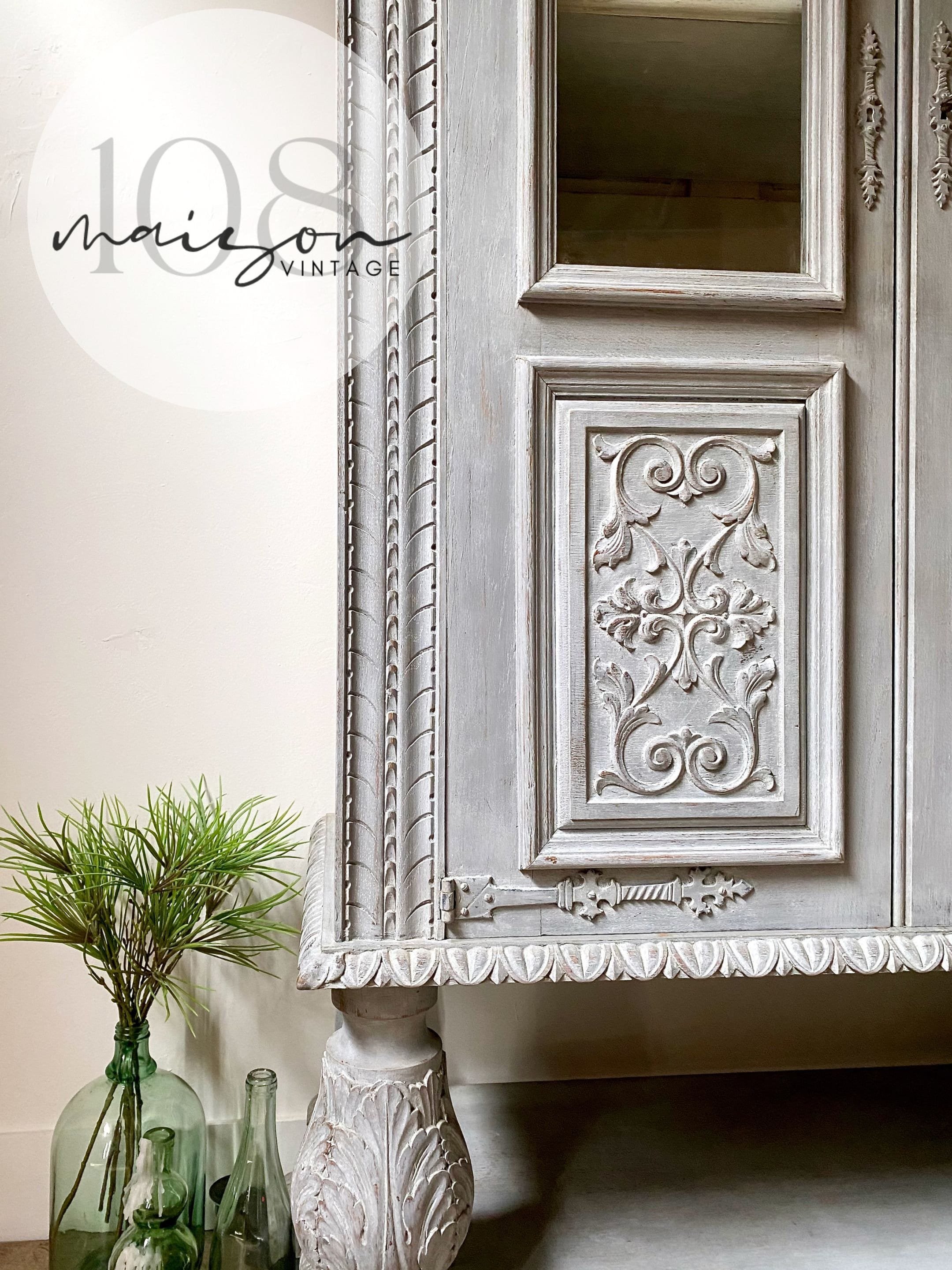 Solid wood 2 door hutch/cabinet with intricate carvings hand-painted in light gray with ivory interior. Vintage French Bibliothèque 1960s