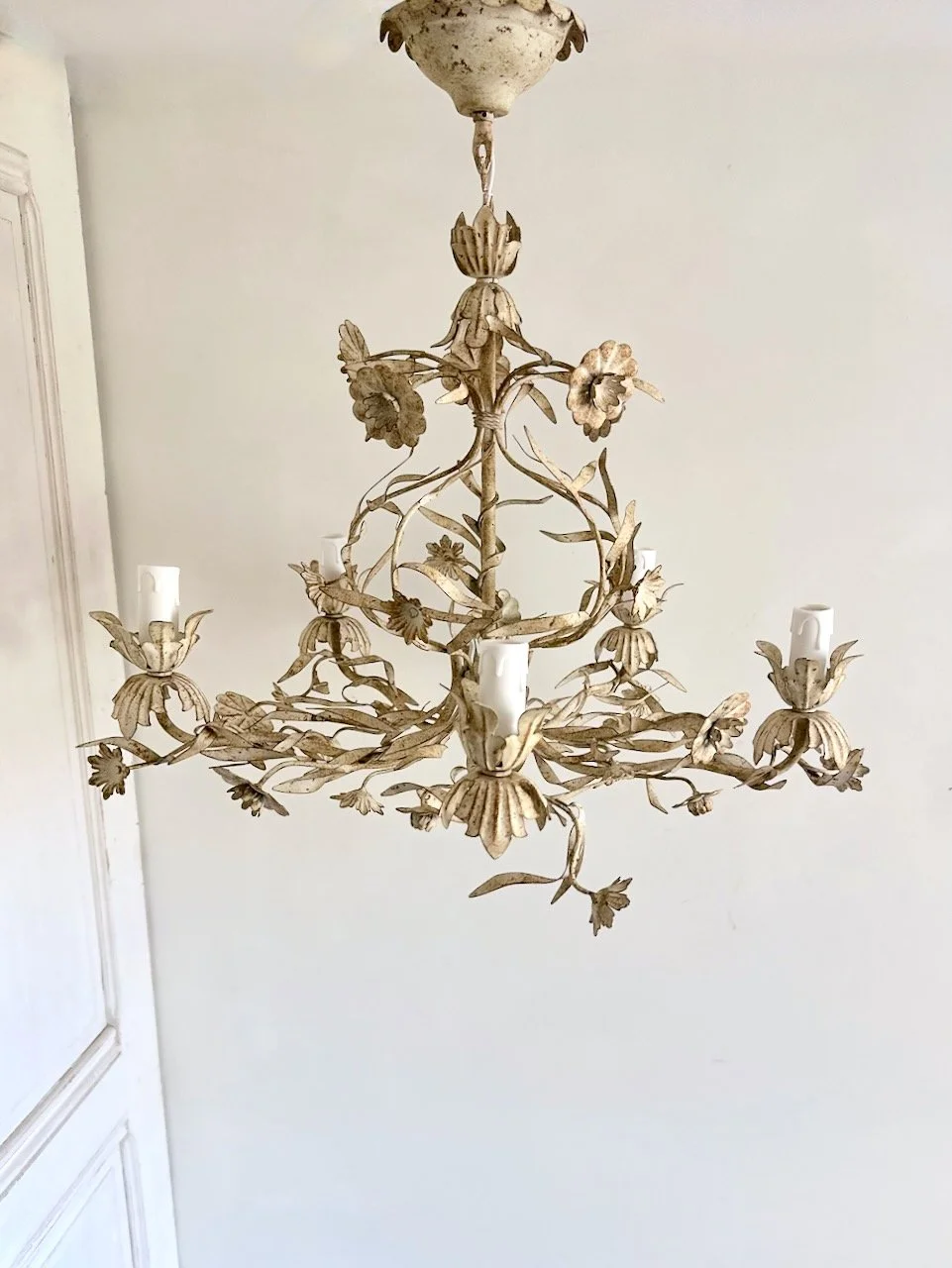 Detailed view of hand-shaped metal flower on a vintage cream floral tole chandelier attributed to 1970s Italian Florentine production..jpeg