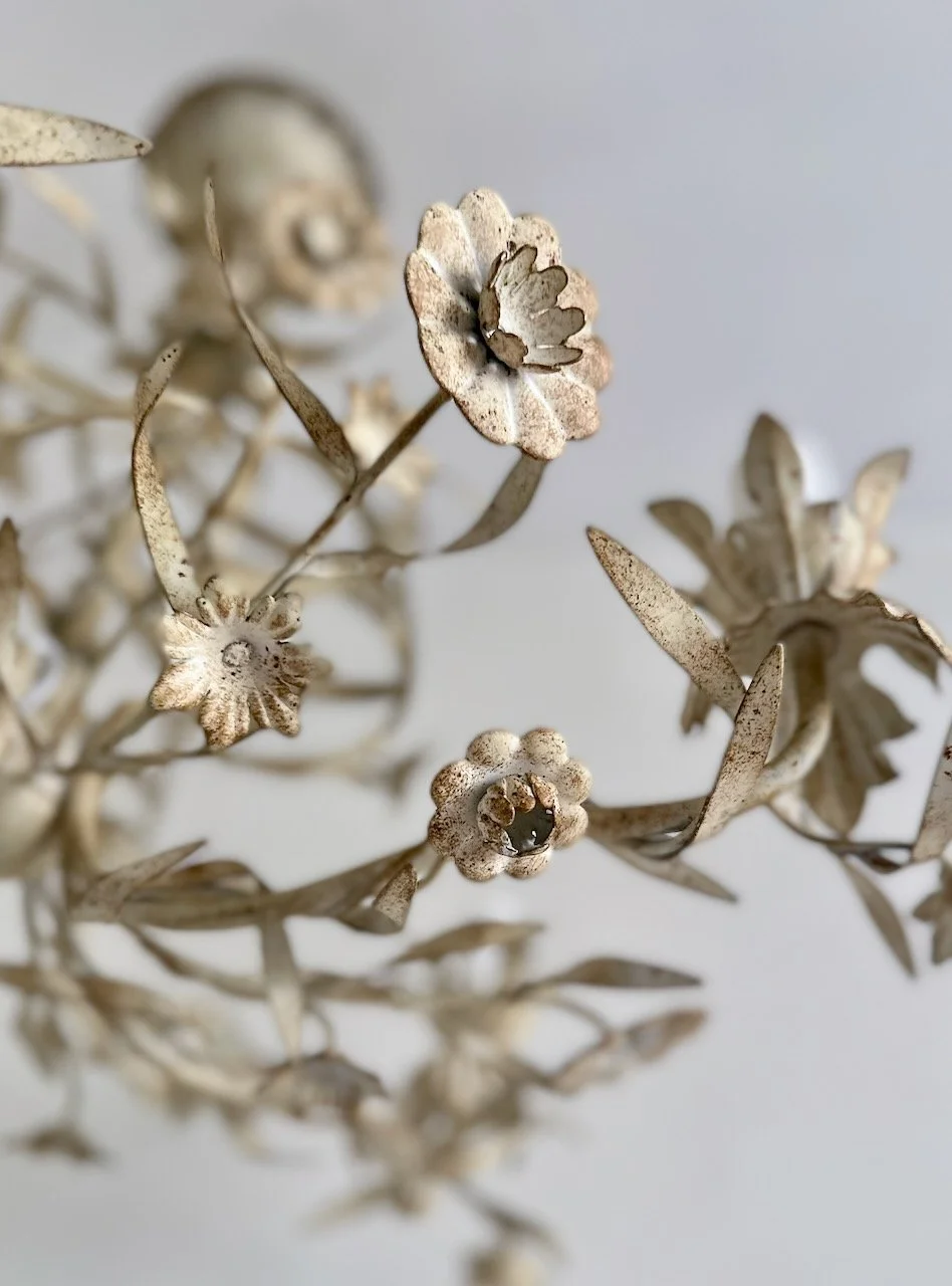 vintage Italian floral tole chandelier with cream painted metal flowers, leafy vines and an ornate five-light arm.jpeg
