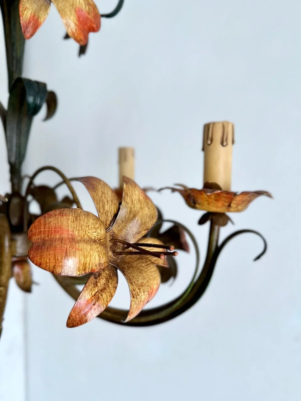 IClose-up of hand-painted coral and ochre metal flower on vintage Italian polychrome tole chandelier MG_6554.jpeg