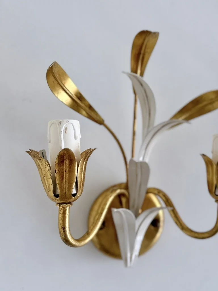 Coordinating pair of Italian Mid-Century floral wall lights displayed together against a white wall.