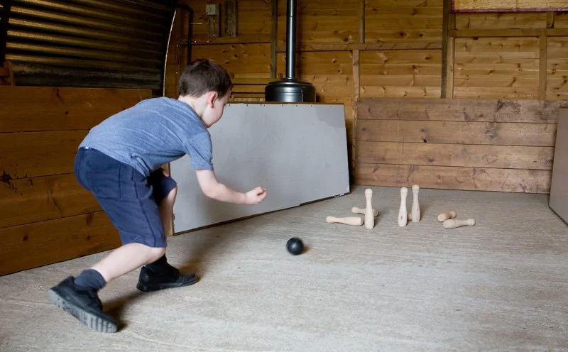 boy playing skittles