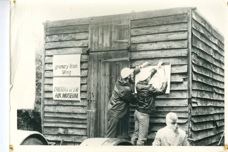 Plans being looked at leaning on a wall