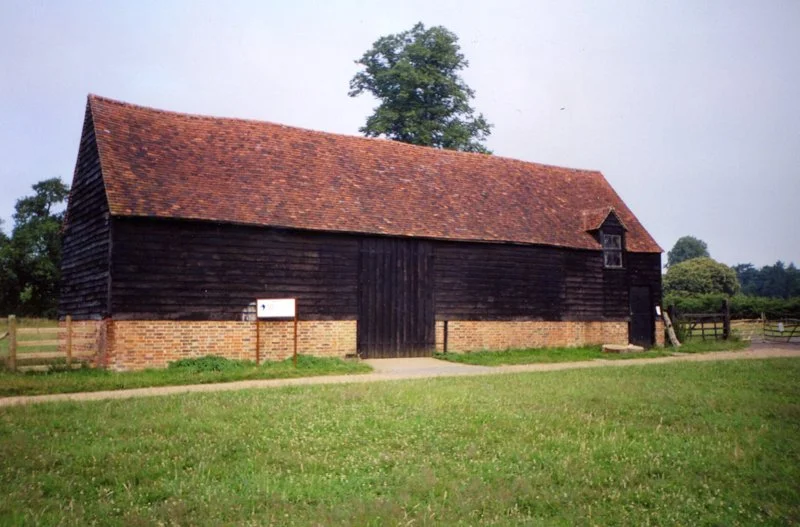 View of large black barn