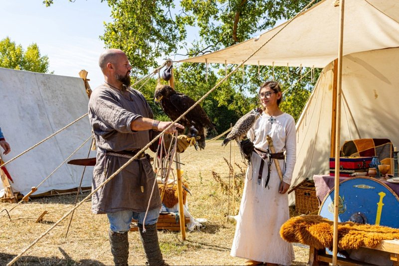 Reenactors holding falcons