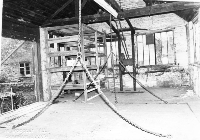 Chains hung from ceiling beams over platform