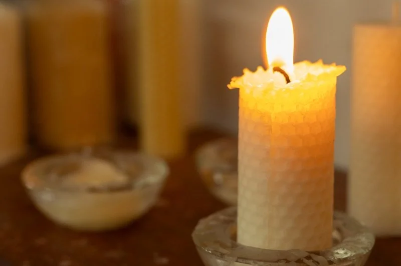A rolled beeswax candle in the shop at Chiltern Open Air Museum