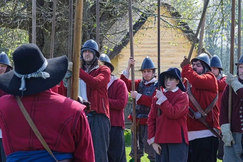 A group of costumed re-enactors dressed as pikemen from the English Civil War