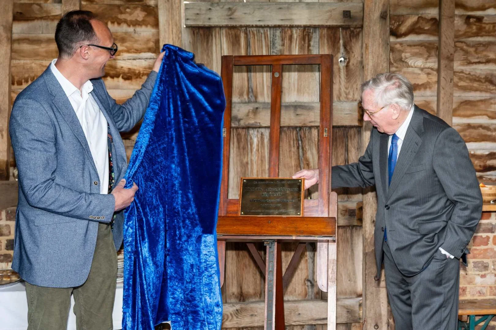 HRH The Duke of Gloucester unveiling a brass plaque to commemorate his visit to Chiltern Open Air Museum in its 50th anniversary year