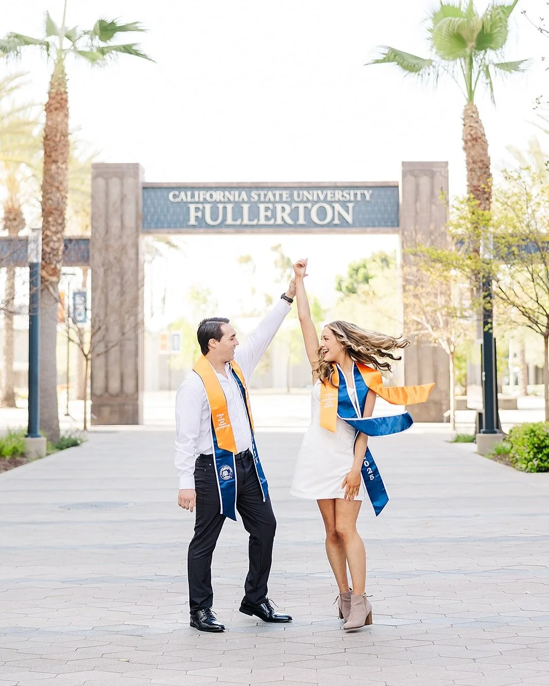 Just the cutest grad couple in town 🎓🧡💙
