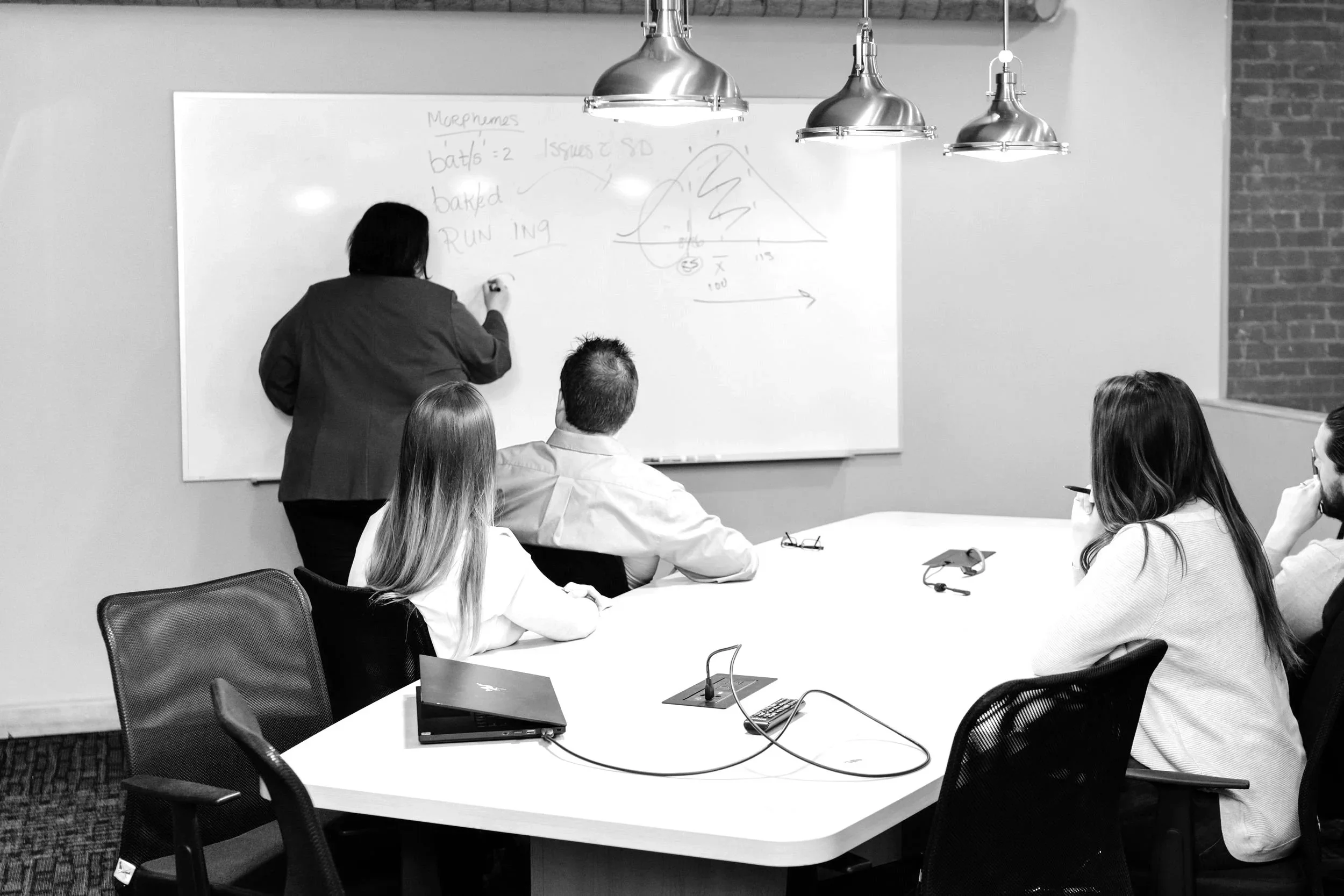 katrina instructing class using whiteboard
