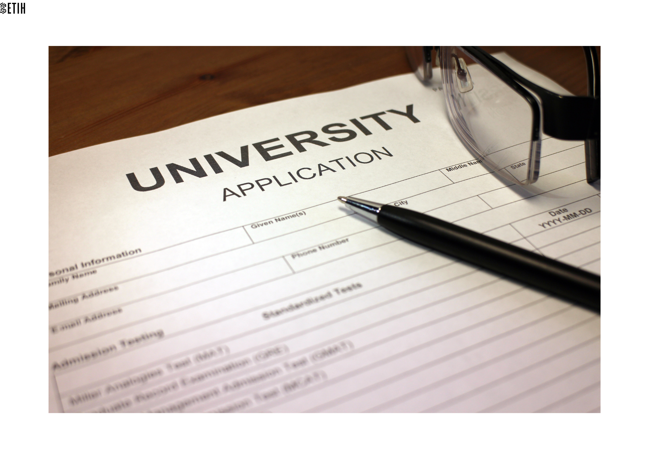 An uncompleted university application form and pen illustrating students' willingness to apply for AI based degree courses