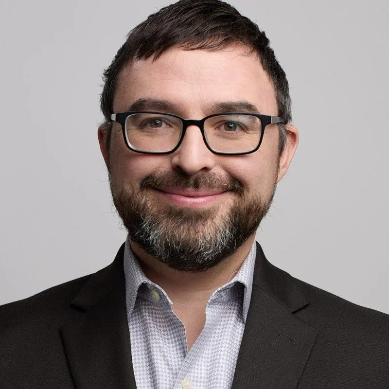 A headshot of Michael Belinsky, illustrating ETIH’s coverage of his appointment to develop the OpenAI Foundation’s civil society and philanthropy work.