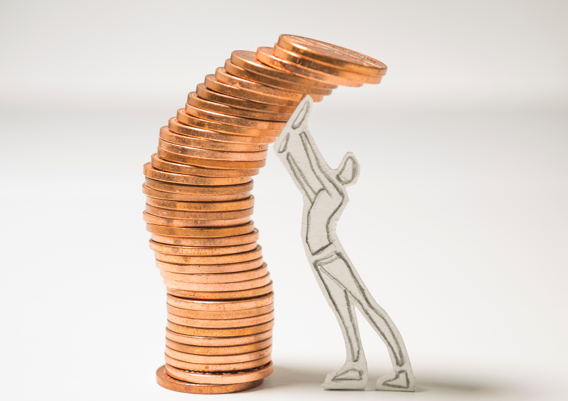 Stack of copper coins curving upward beside a hand-drawn figure reaching toward the top, illustrating step-by-step financial learning and growth.