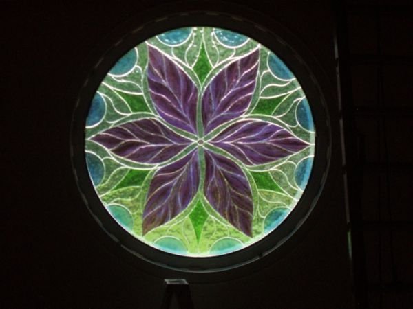 Yoga Barn, Chilmark - This fused and bonded stained glass window was built for the Yoga Barn for Scarlett Jarrell from a small sketch she made. Barney built this 60" diameter with his fused glass technique using metal oxides between the layers of sta