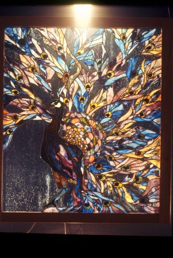 Leaded stained glass, 1977 - This 48" x 60" Peacock window was commissioned for a client in Ohio. It had 1000 pieces of stained glass cut from handmade rolled sheet glass.