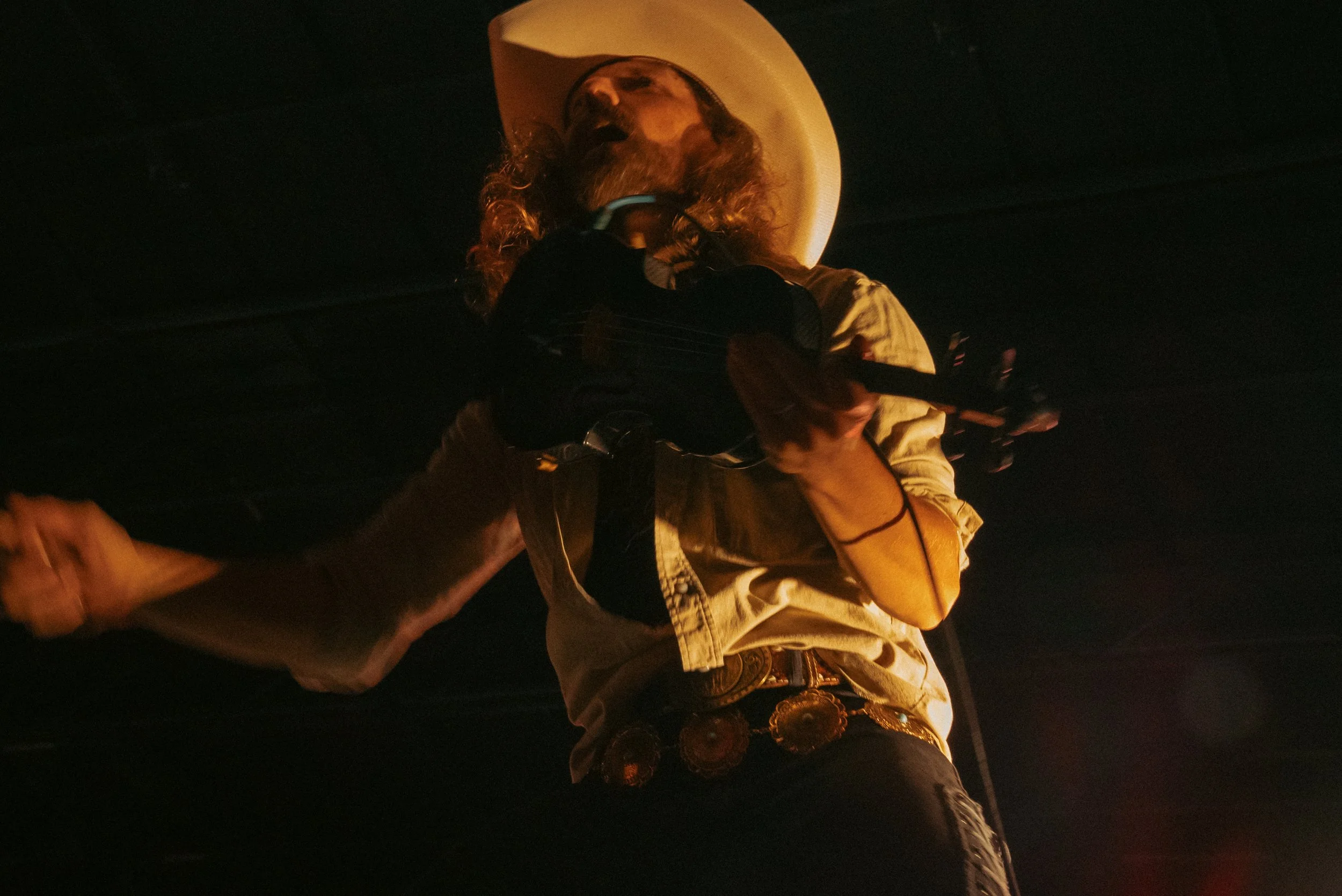 Rodney Atkins Fiddle player on stage at the Summit County Fairgrounds in Coalville, Utah.