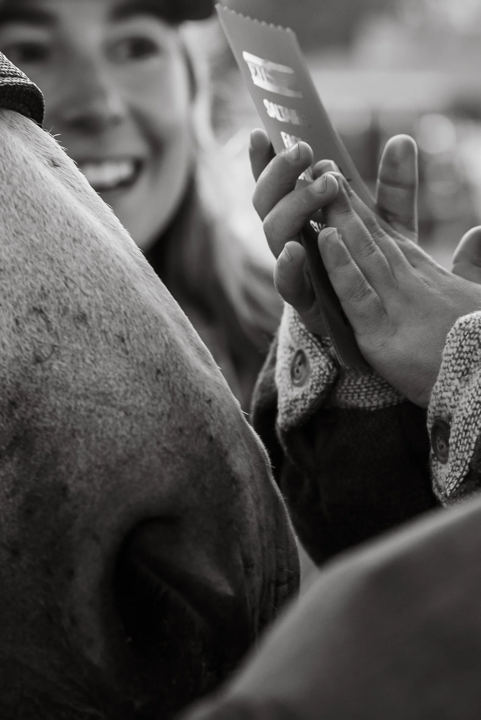 A photo of a boy winning a blue ribbon at a horse show