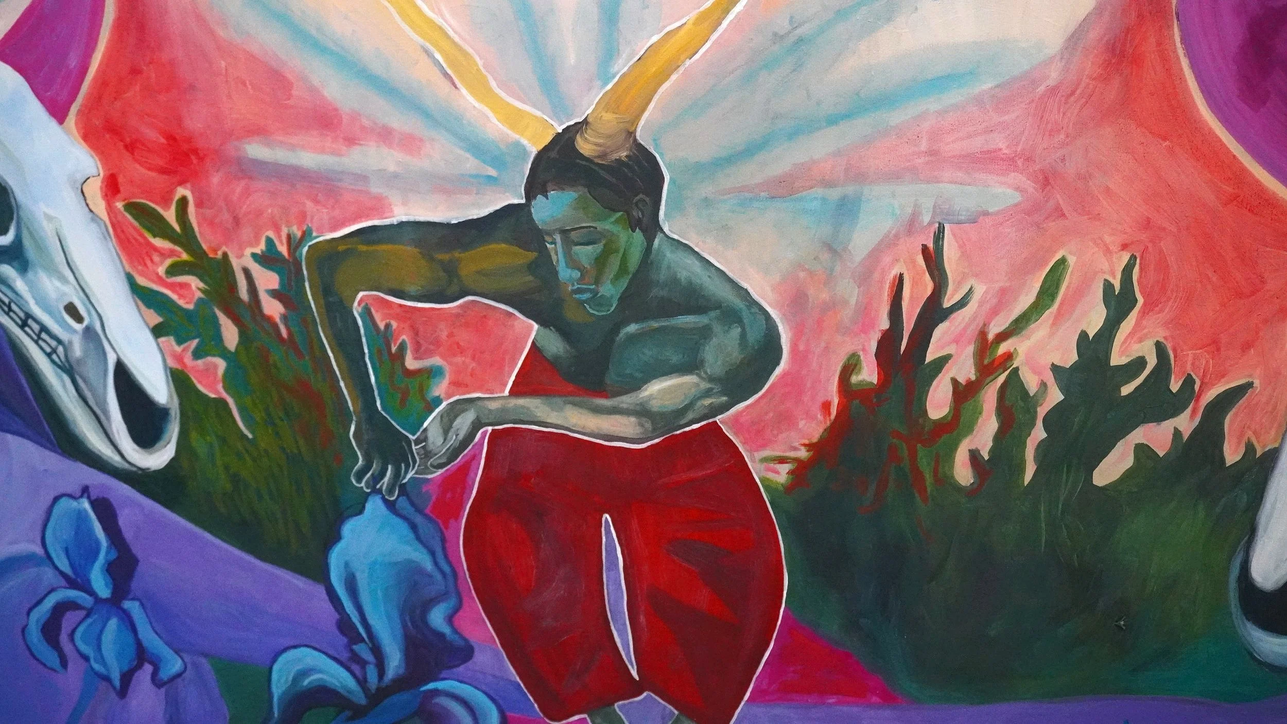 Abstract painting of a horned figure in red pants with outstretched arm, surrounded by colorful foliage and a skull on the left.