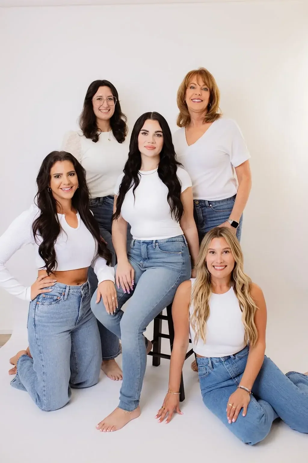 Five women in matching white
