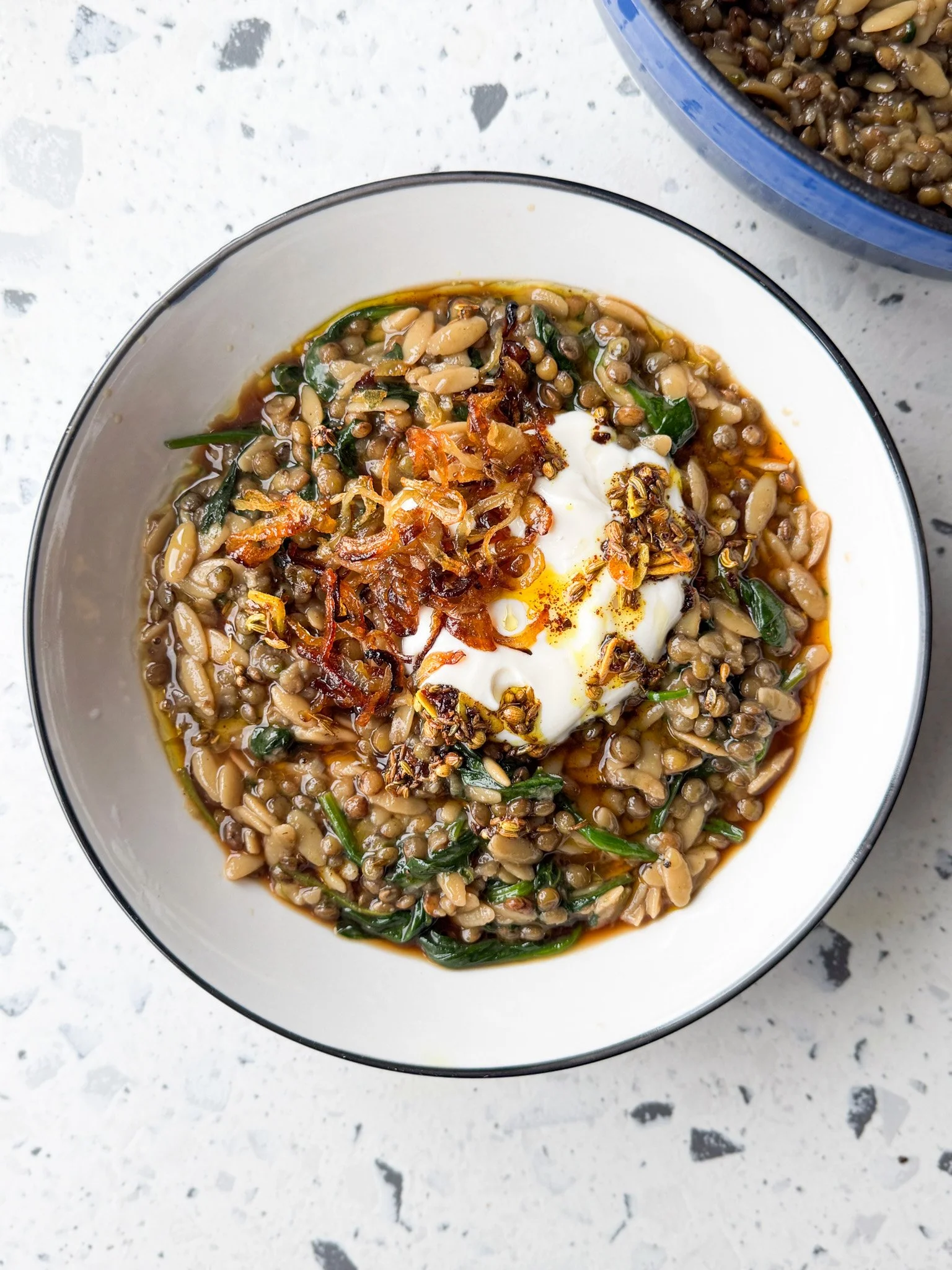 Caramelised onion, lentil and orzo stew (mujadarra), with spiced oil