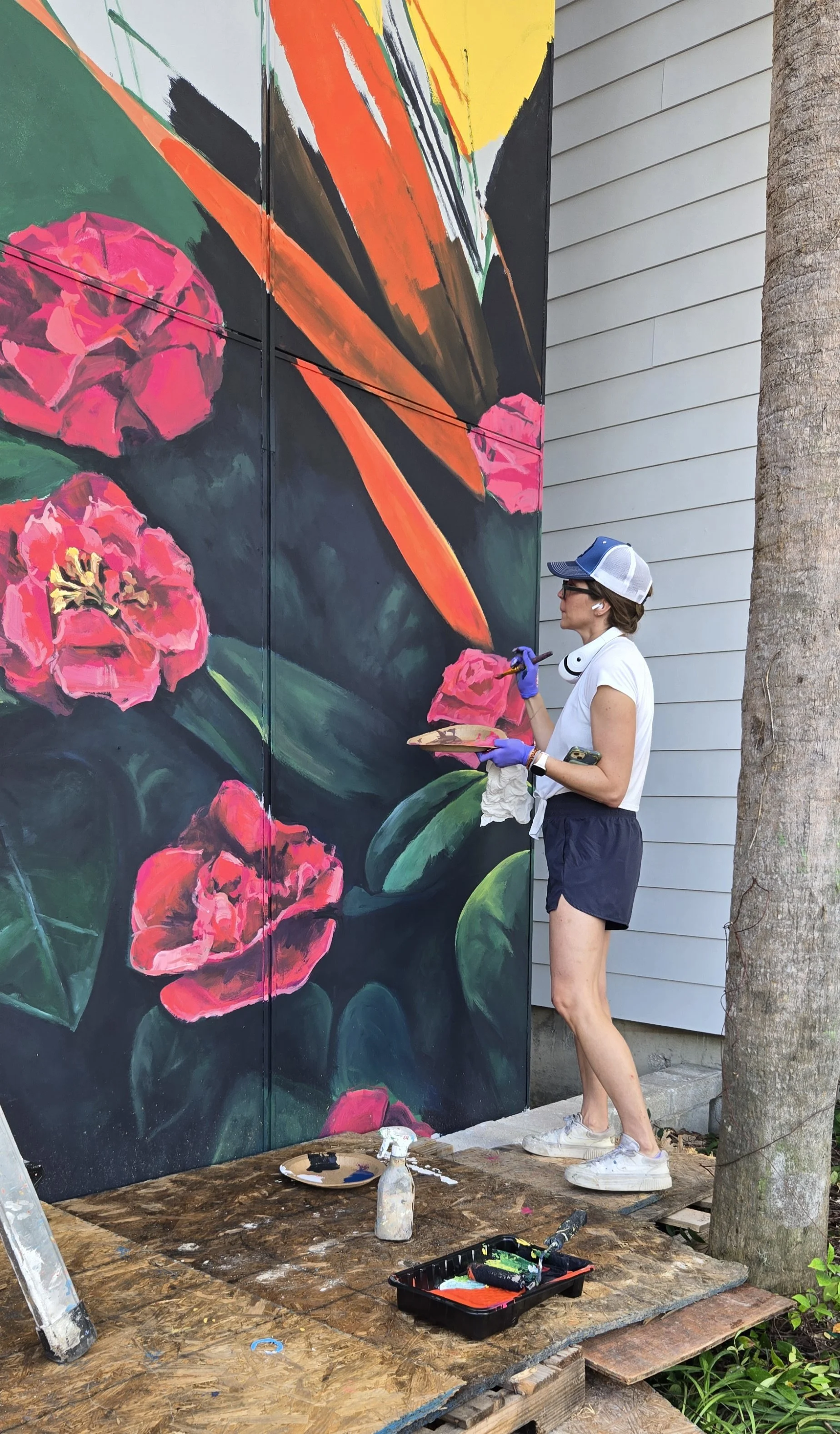 Artist Kristin Chronic works on the mural.jpg
