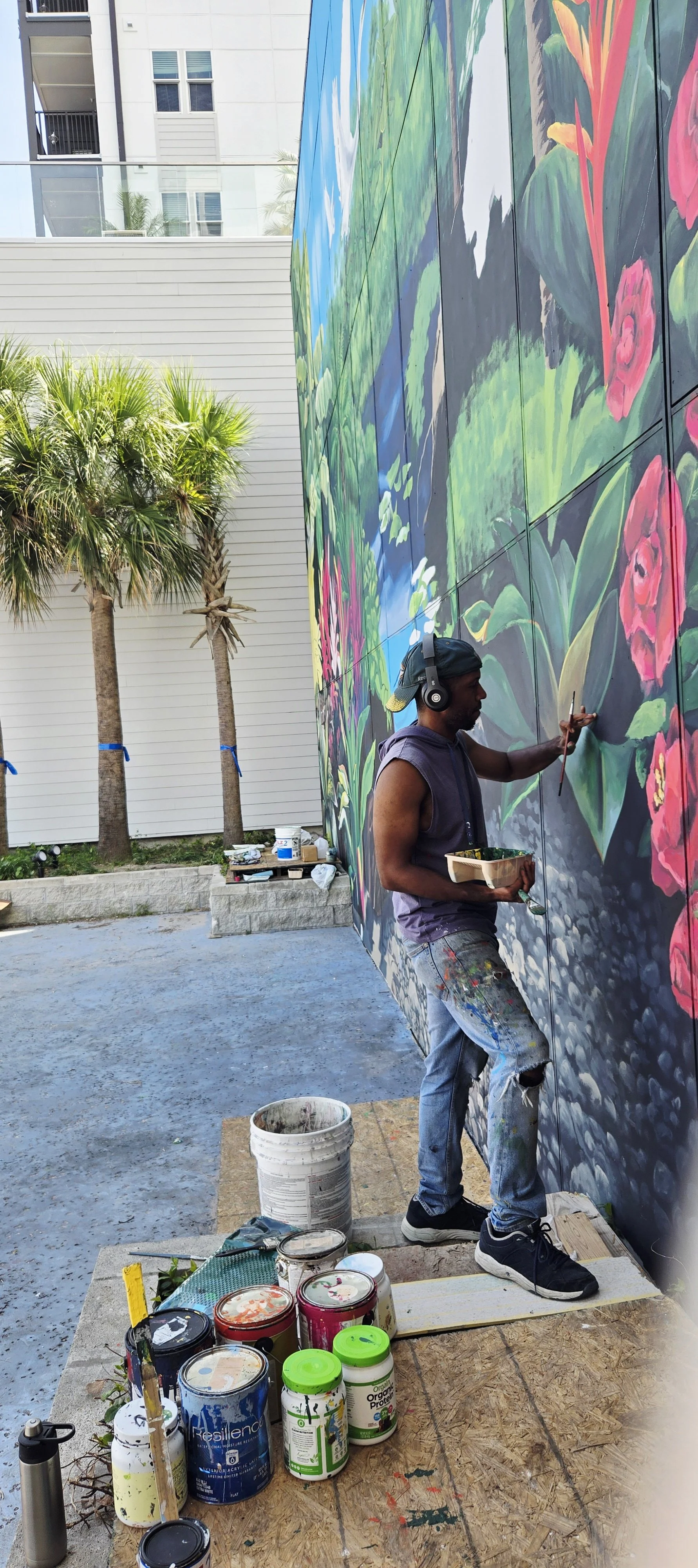 Artist Keith Doles works on the mural.jpg