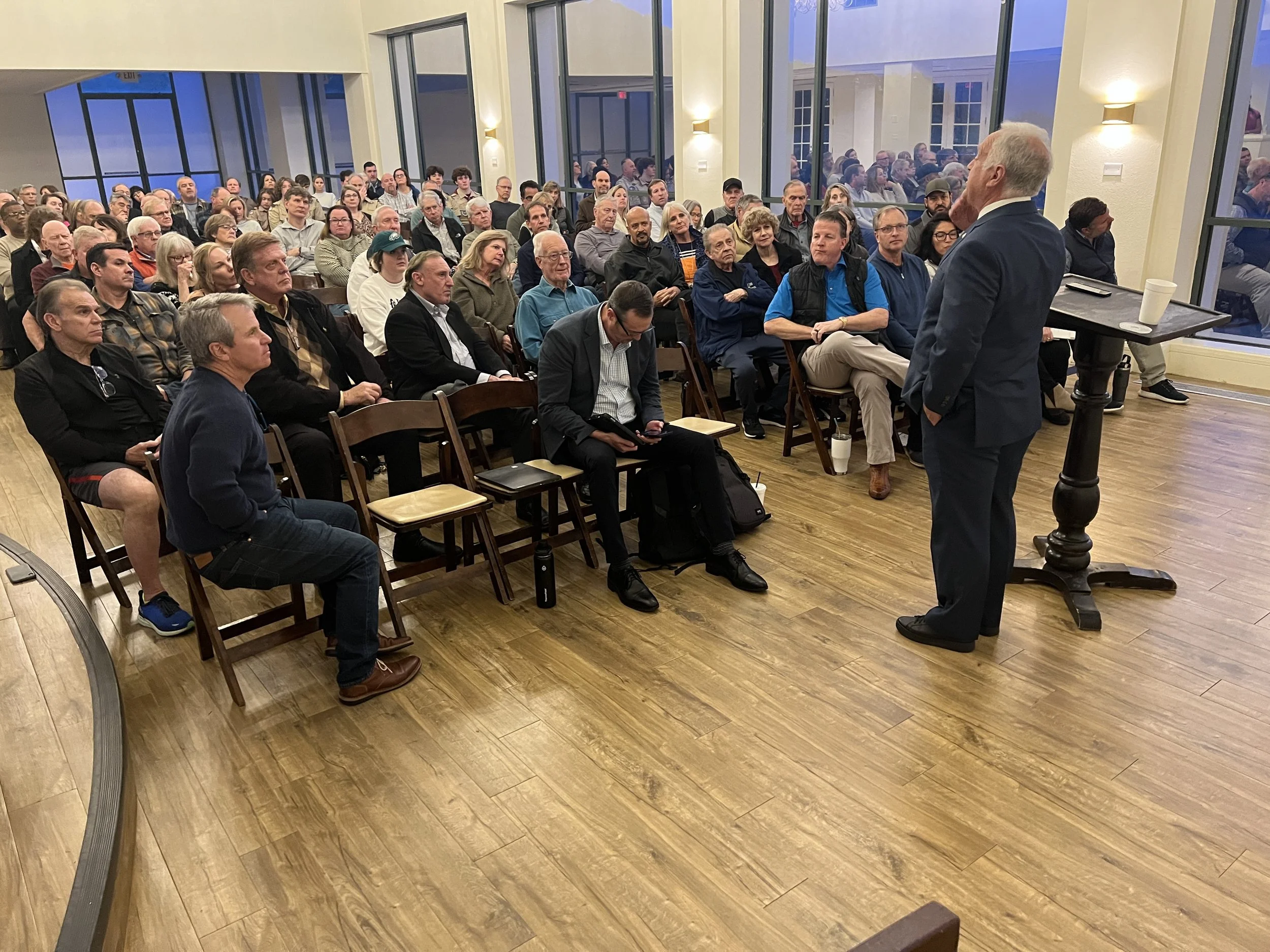 Mayor Kirk Watson speaking to a full house.