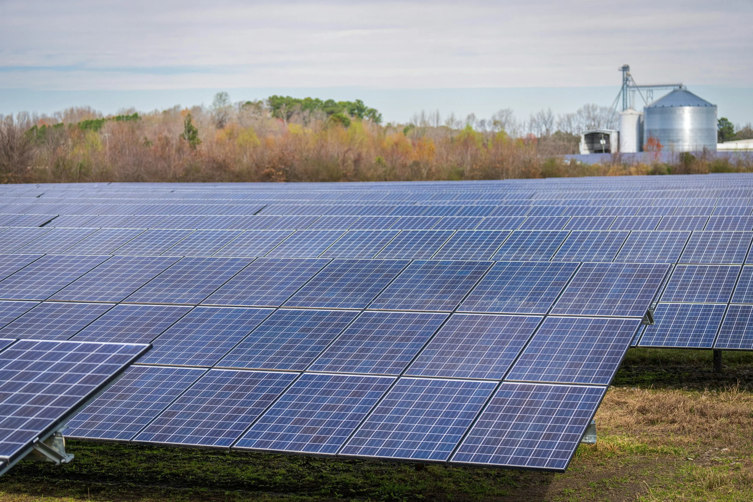 Emergency response team using solar-powered equipment in a disaster-affected area, highlighting the role of solar panels in restoring power and communication.