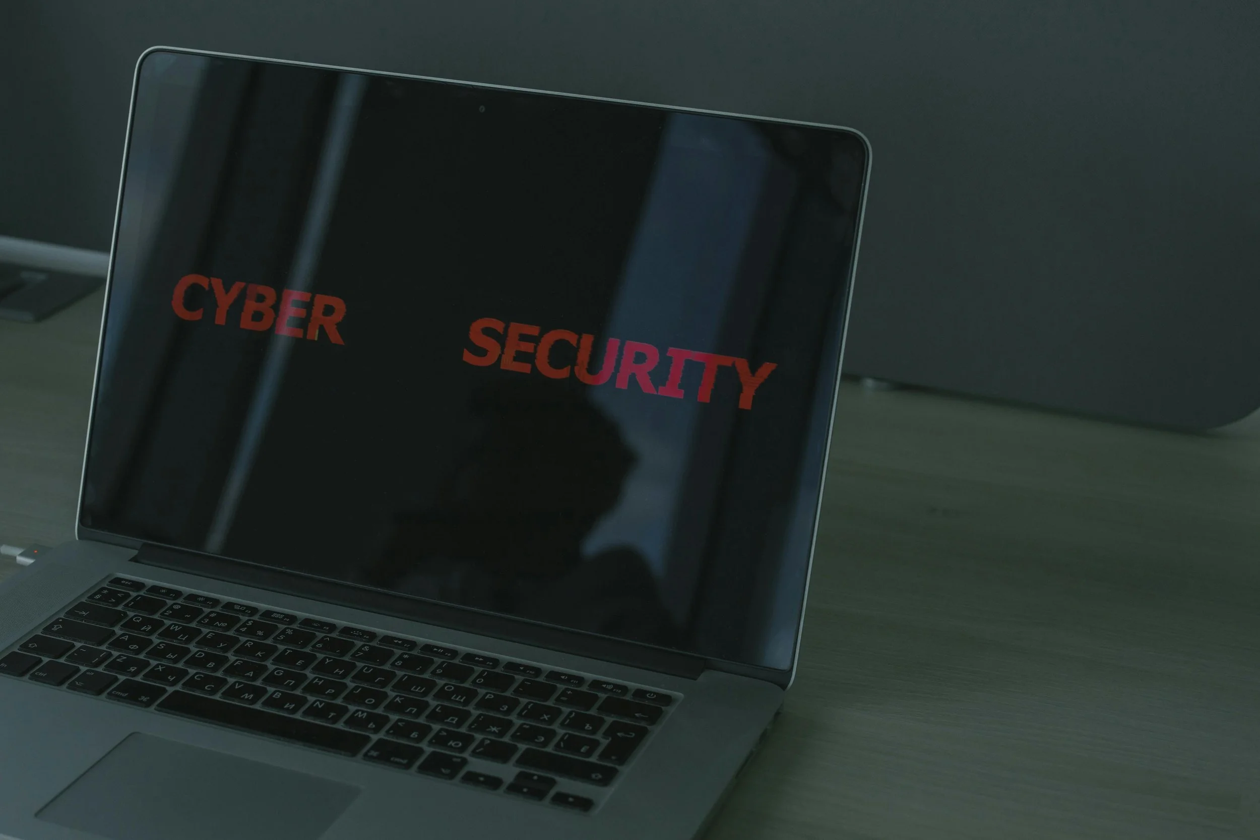 Laptop screen displaying the word “cybersecurity,” symbolising digital protection through advanced technologies like blockchain.