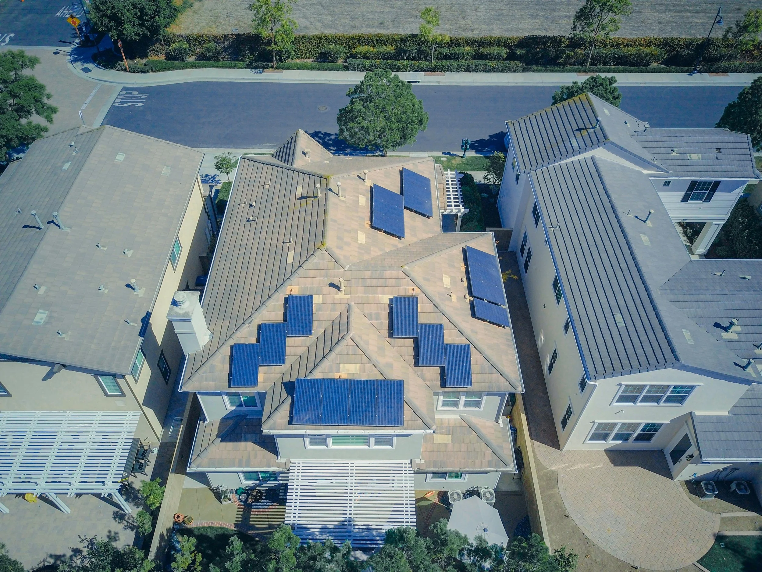 A rooftop with newly installed solar panels under the Australian sun, symbolising savings from government solar rebates and incentives.