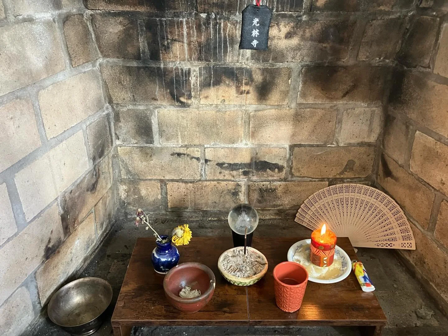 Really happy with this new altar space in a decommissioned fireplace 😌 

First time implementing the traditional rice and water offering bowls too, and first time with Kanon as my honzon (in a crystal ball no less- let it not be said she doesn&rsquo