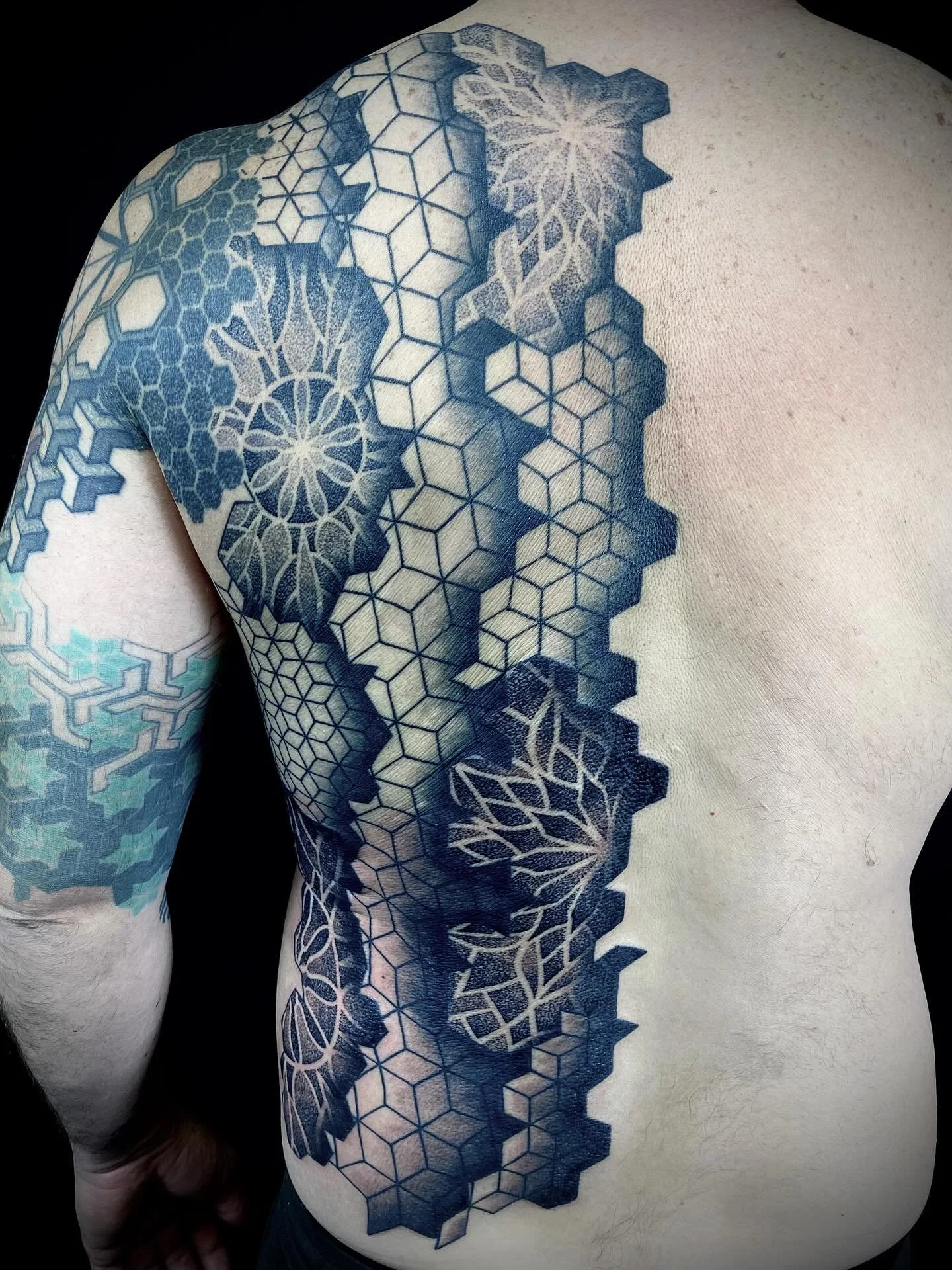 Completed this 1/2 back geometric/mandala piece yesterday. The arm was done by another artist. We managed to do this in three sittings here at Paradigm Tattoo in Victoria BC.