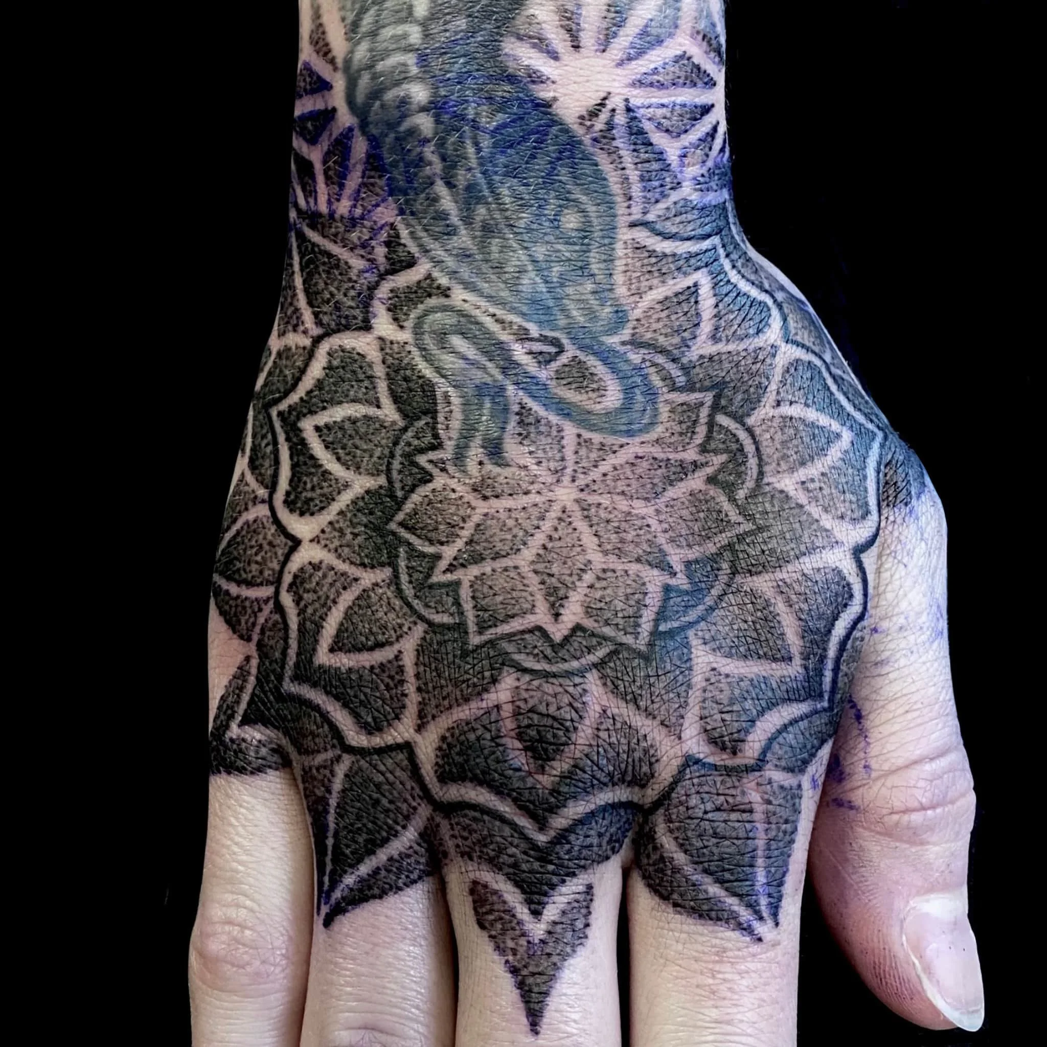 Dotwork mandala hand tattoo.  Ornamental geometric tattoo.  Artist - Cohen Floch  Tattoo studio - Paradigm Tattoo