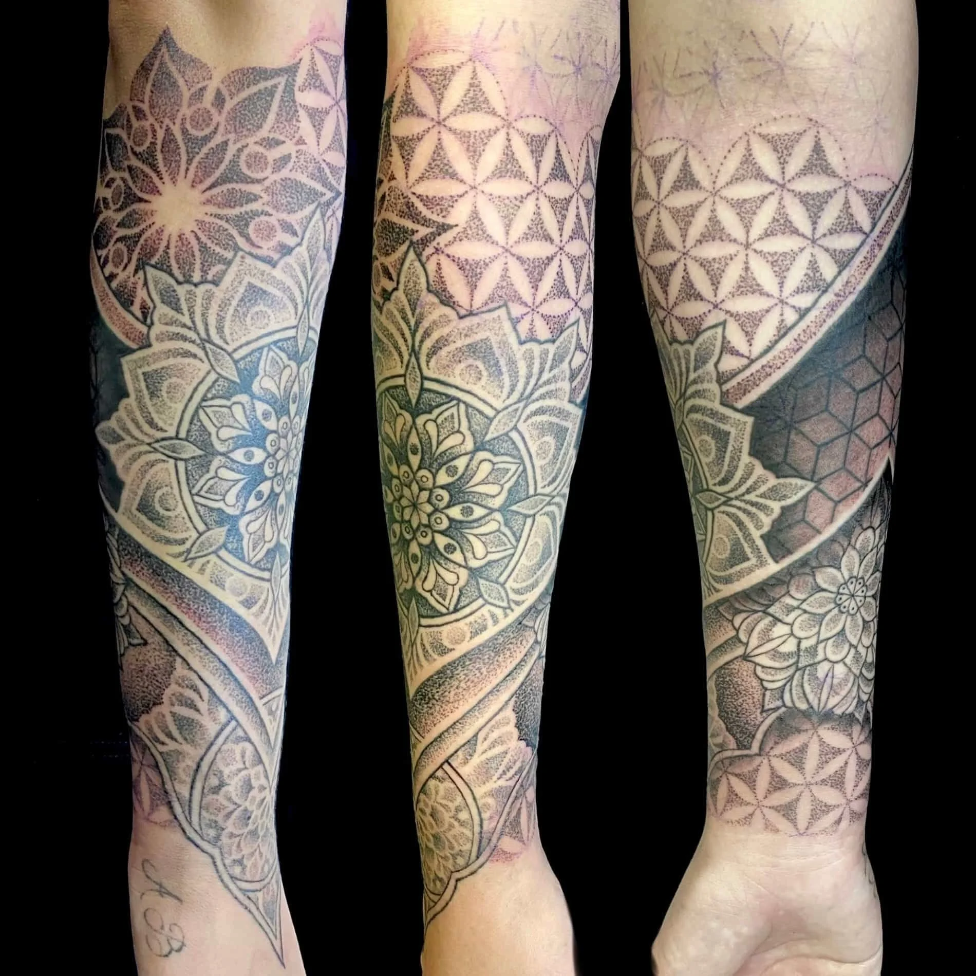 Mandala and sacred geometry tattoo forearm.  Consisting of dotwork, seed of life, and various other geometric patterns.  