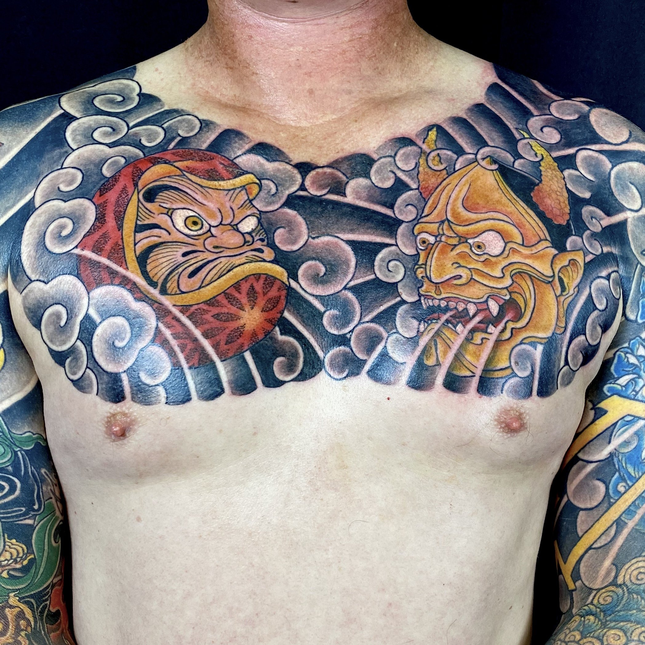 Japanese style chest piece featuring Hannya and Daruma.  Traditional Japanese tattoos done by Cohen Floch at Paradigm Tattoo in Victoria BC.
